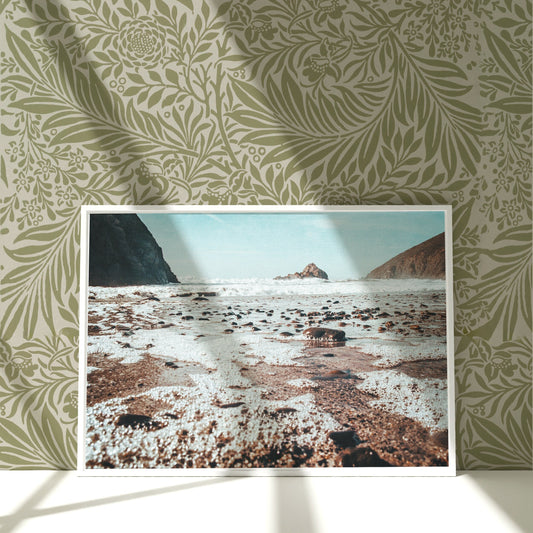 a picture of a picture of a beach with a mountain in the background