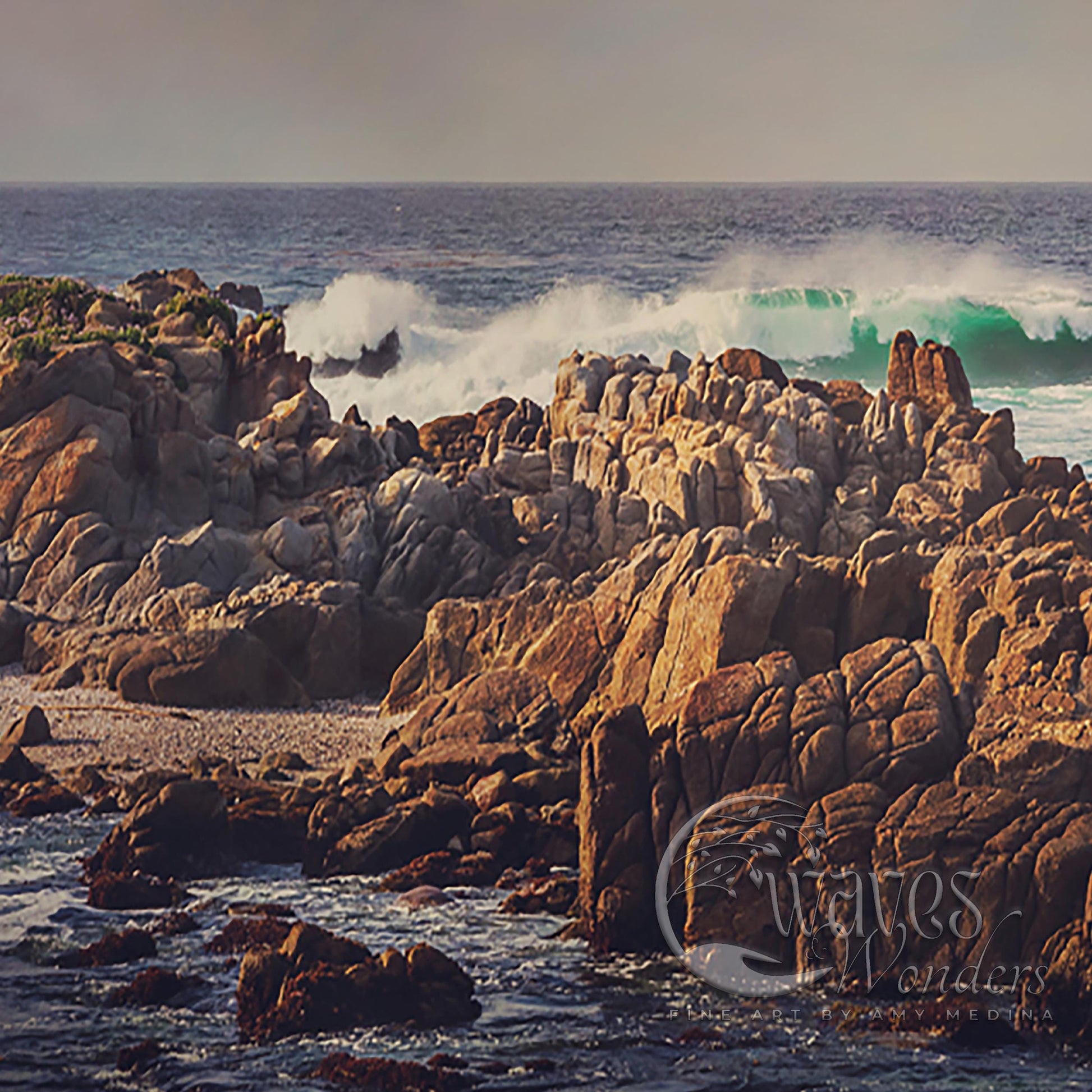 a large body of water next to a rocky shore