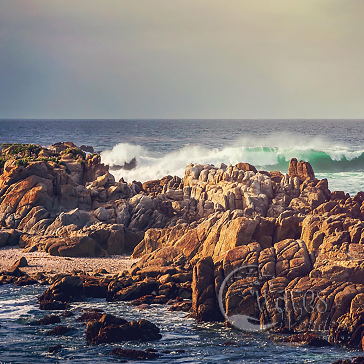 a man riding a surfboard on top of a rocky beach