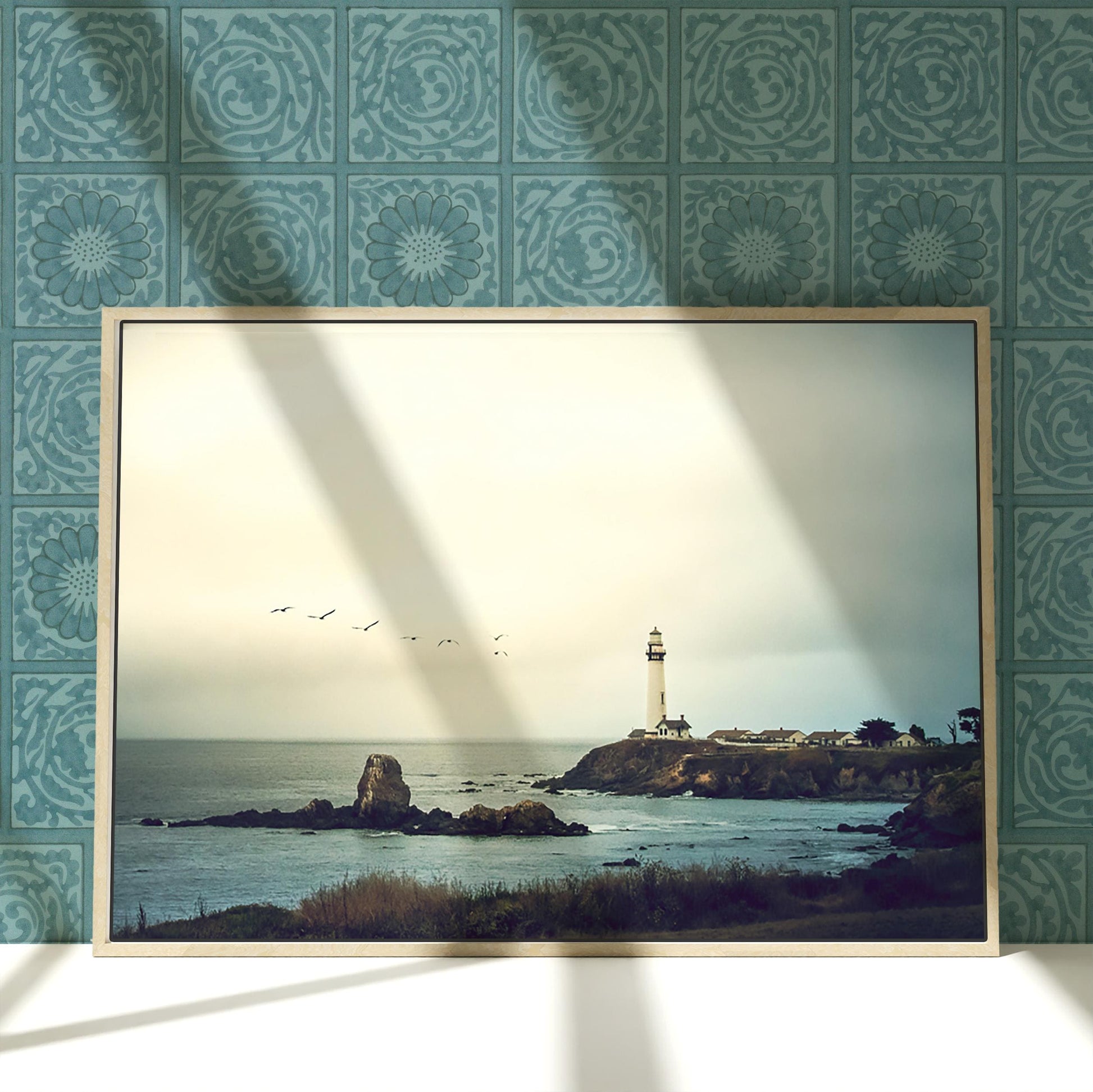 a picture of a picture of a lighthouse on a wall