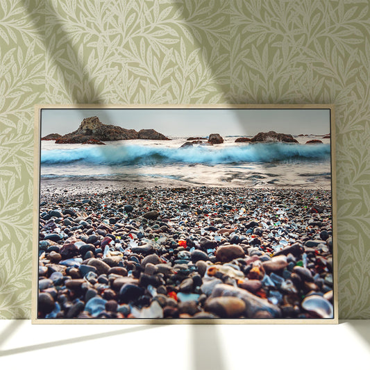 a picture of a beach with a wave coming in