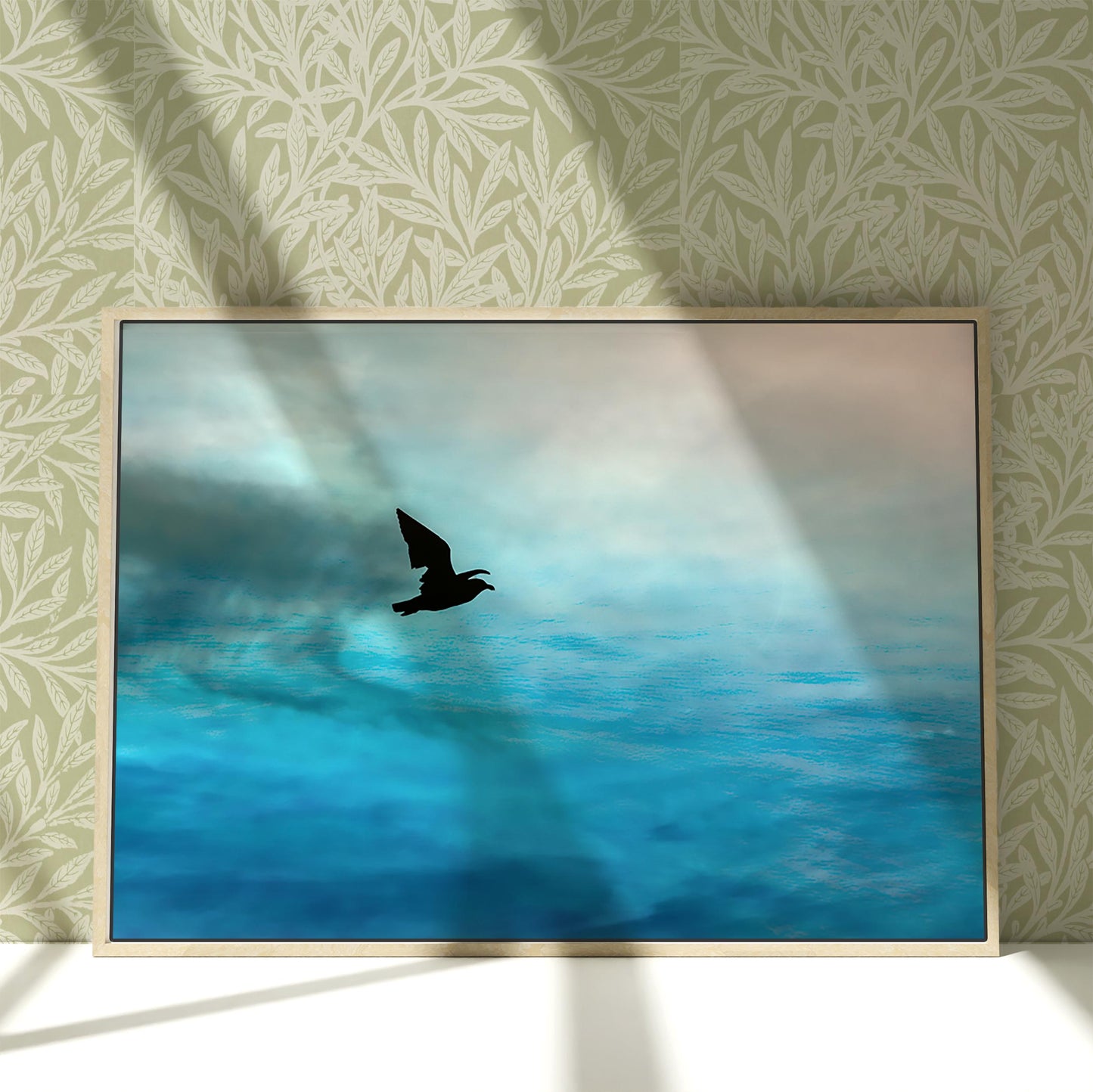 a picture of a bird flying over a body of water