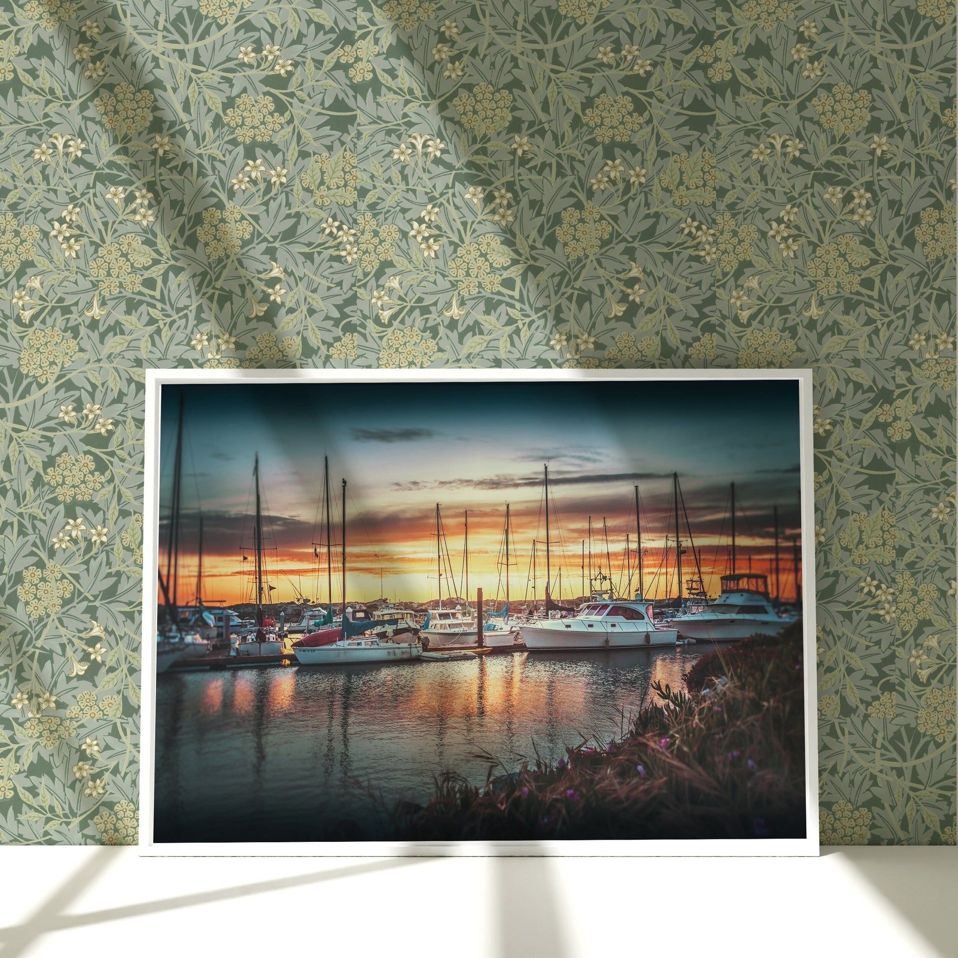 a painting of boats in a harbor at sunset