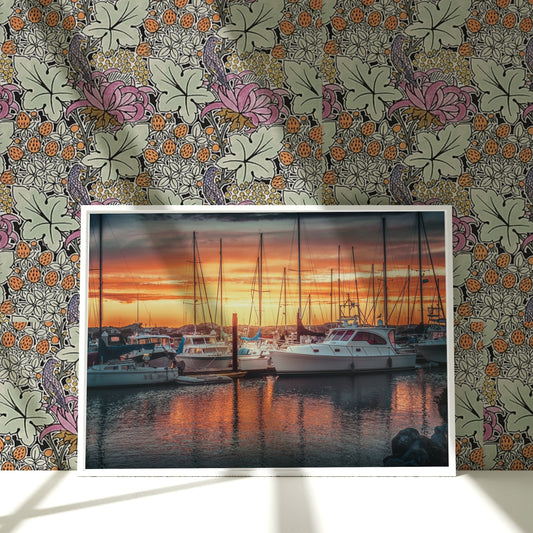 a picture of boats in a harbor at sunset