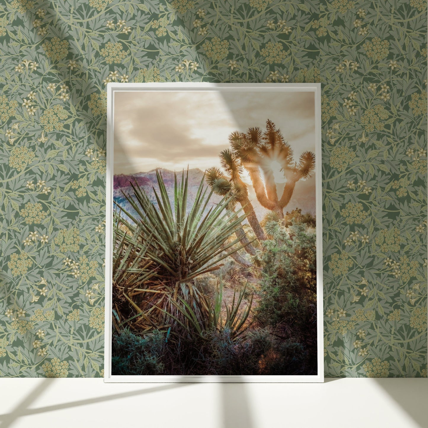 a picture of a cactus in a frame on a wall