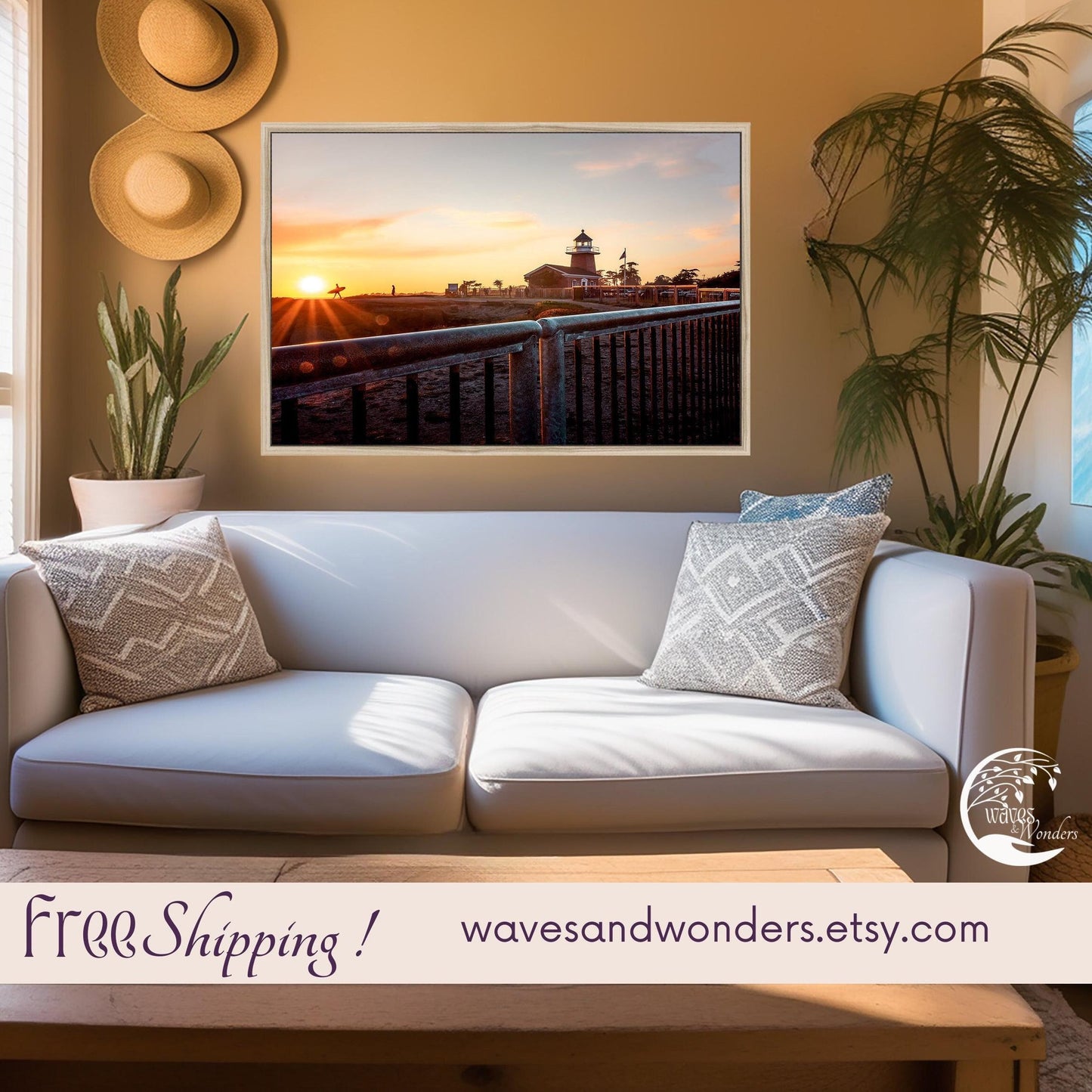 a living room with a white couch and a painting on the wall