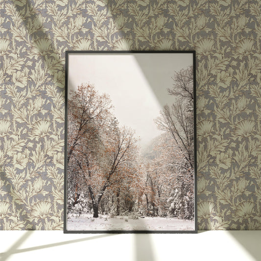 a picture of a snowy forest in a frame