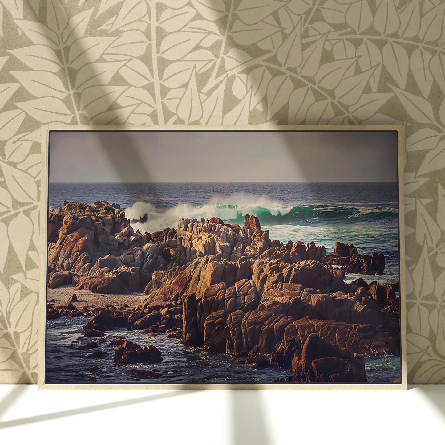 a picture of a rocky beach with waves coming in