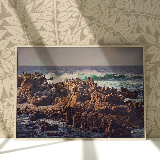 a picture of a rocky beach with waves coming in