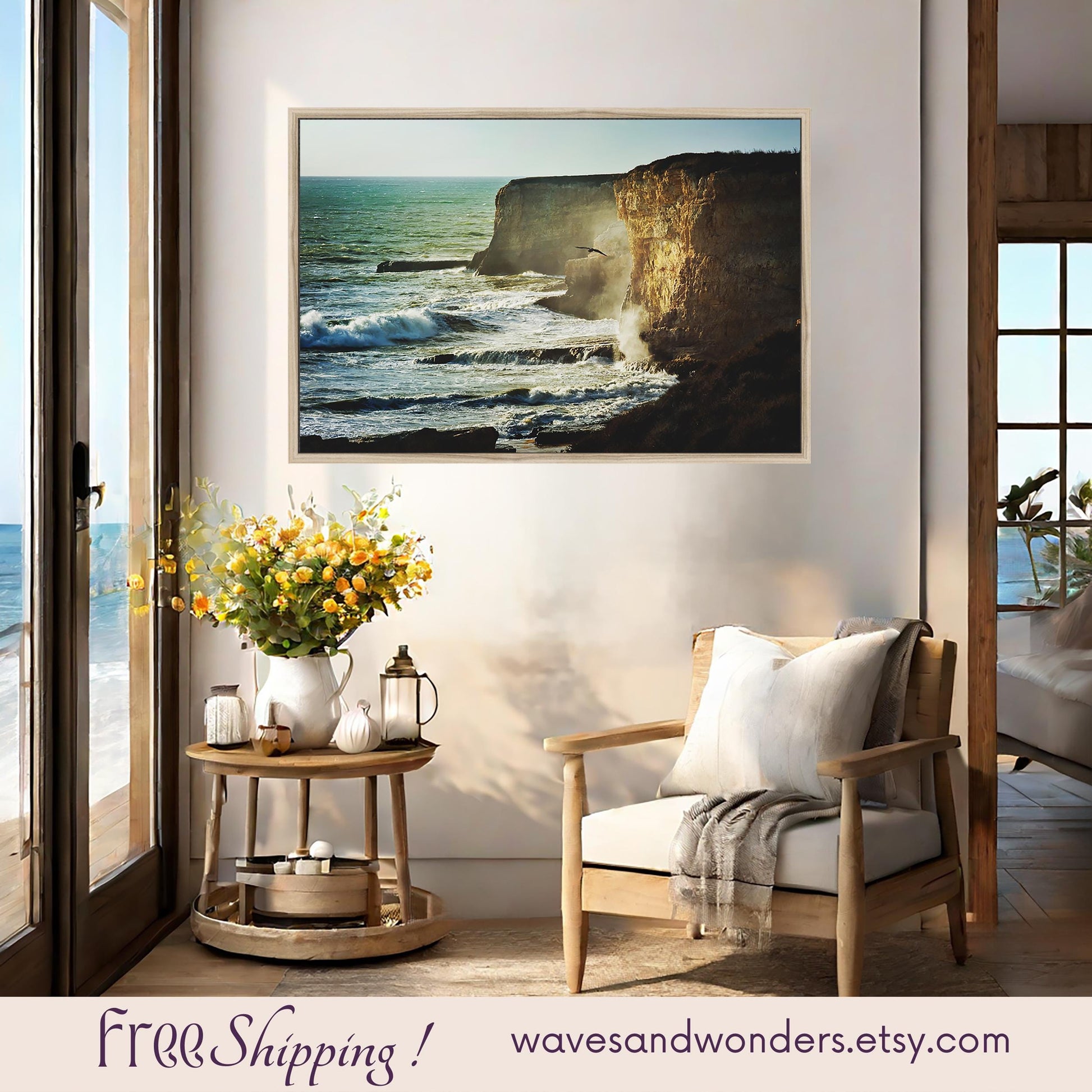 a living room with a picture of the ocean