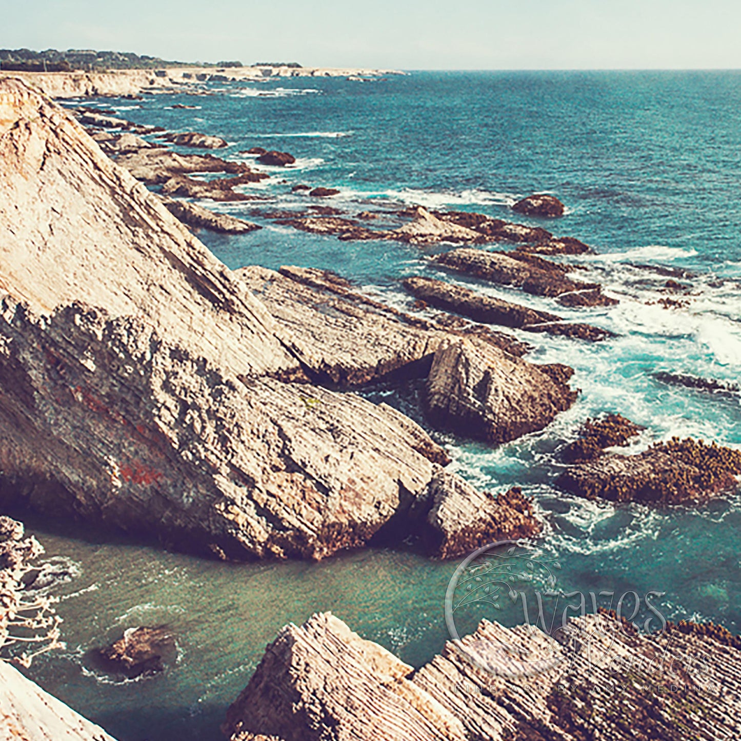 a view of the ocean from a rocky cliff