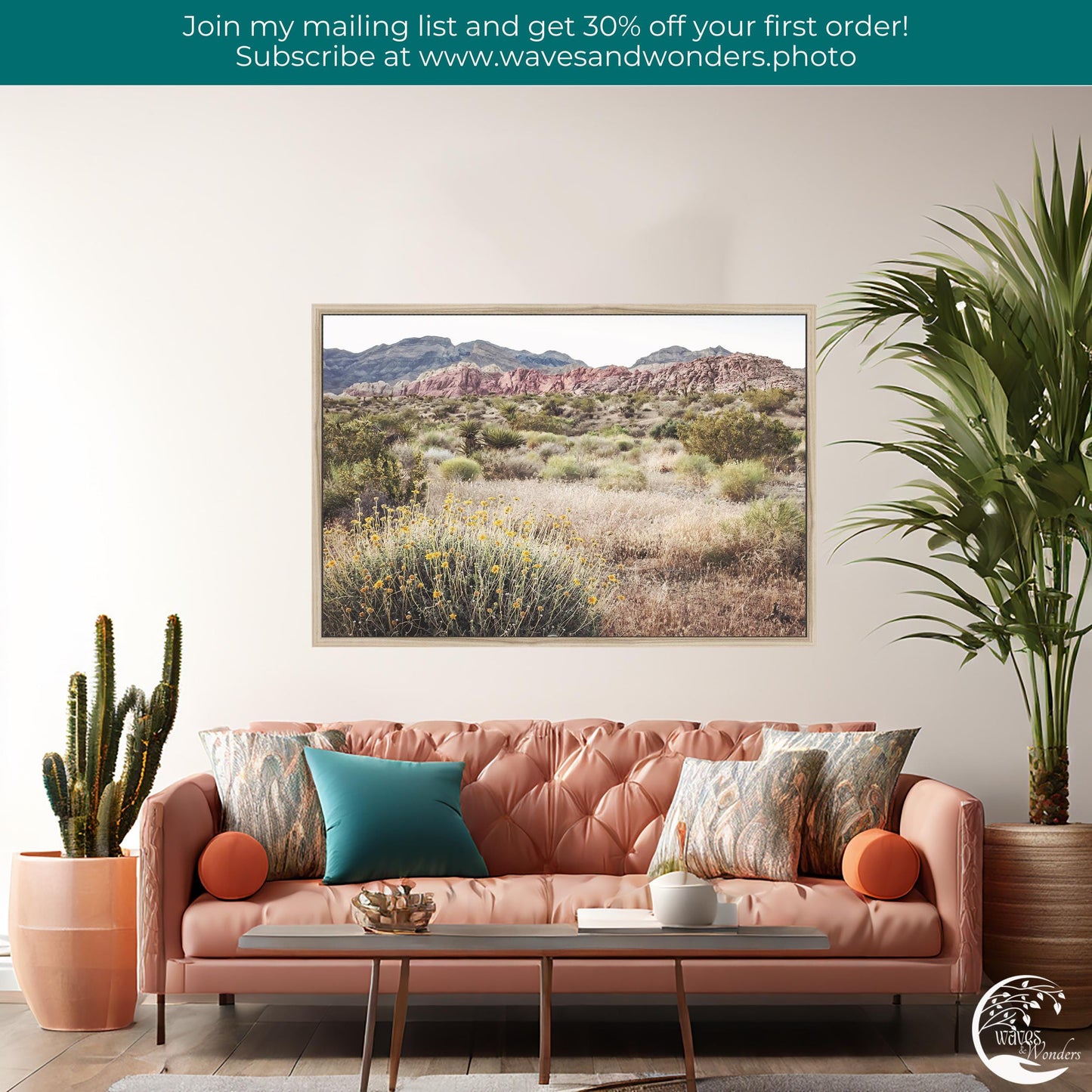 a living room with a pink couch and a potted plant