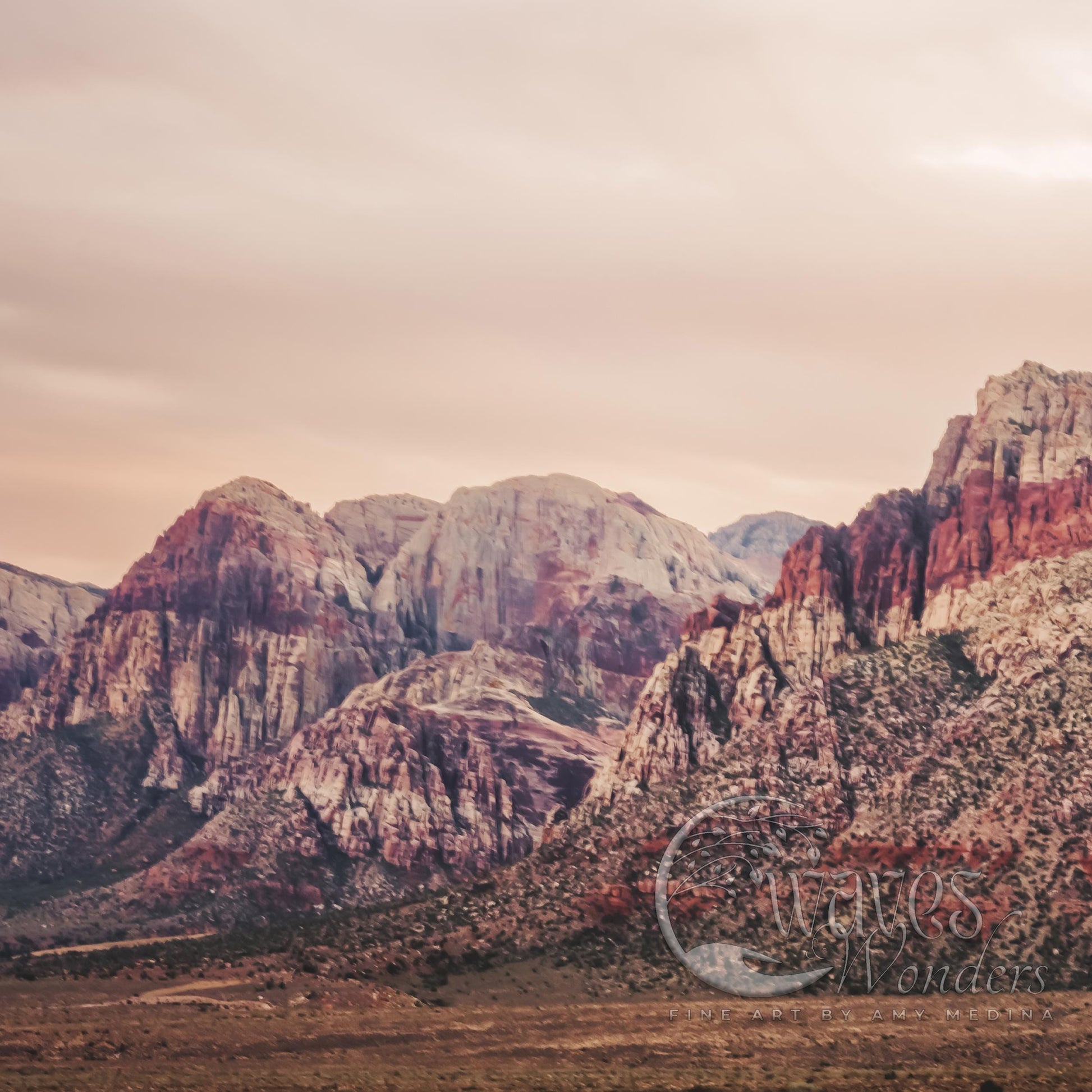 a mountain range with a bicycle parked in the foreground