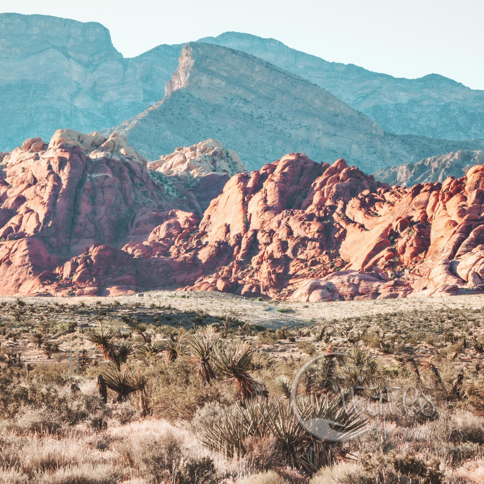 a mountain range in the desert with mountains in the background