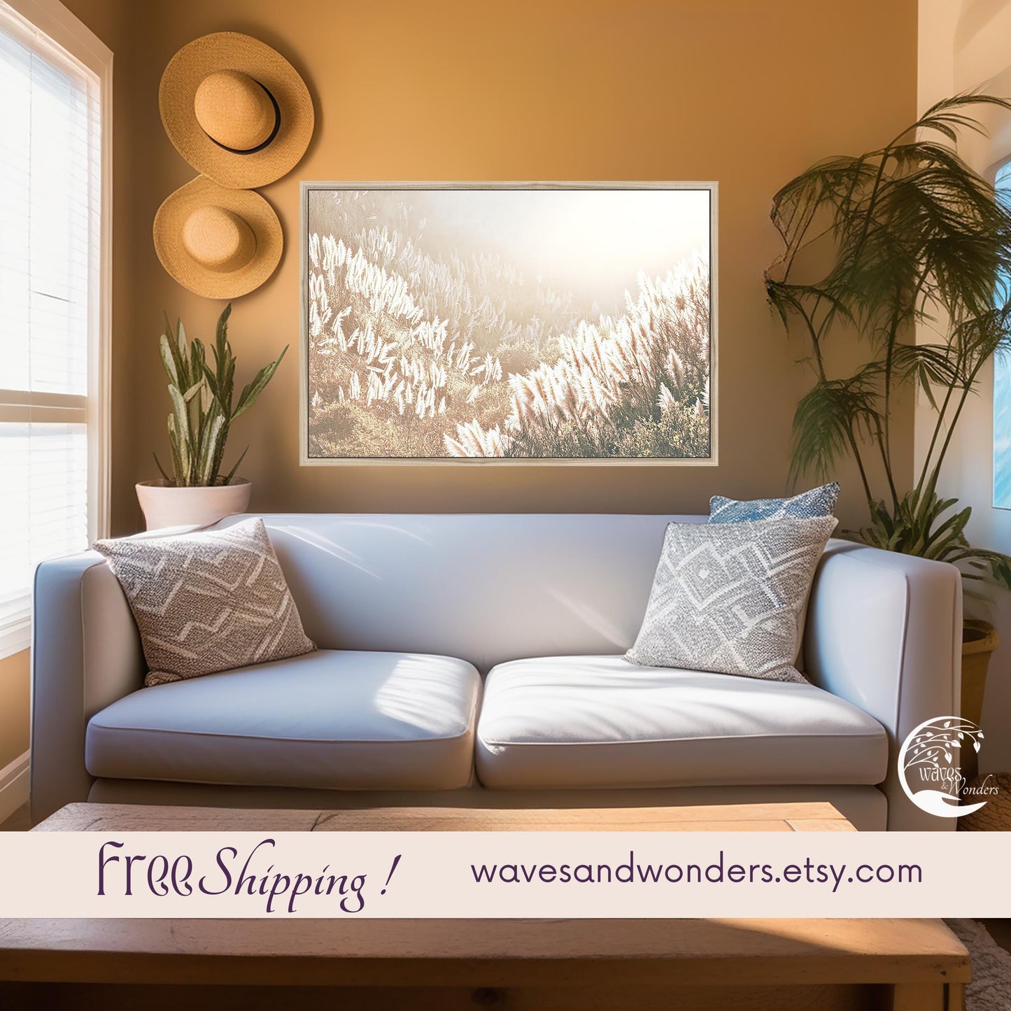 a living room with a white couch and a painting on the wall