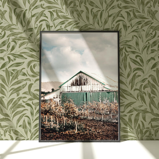 a picture of a barn in the middle of a field