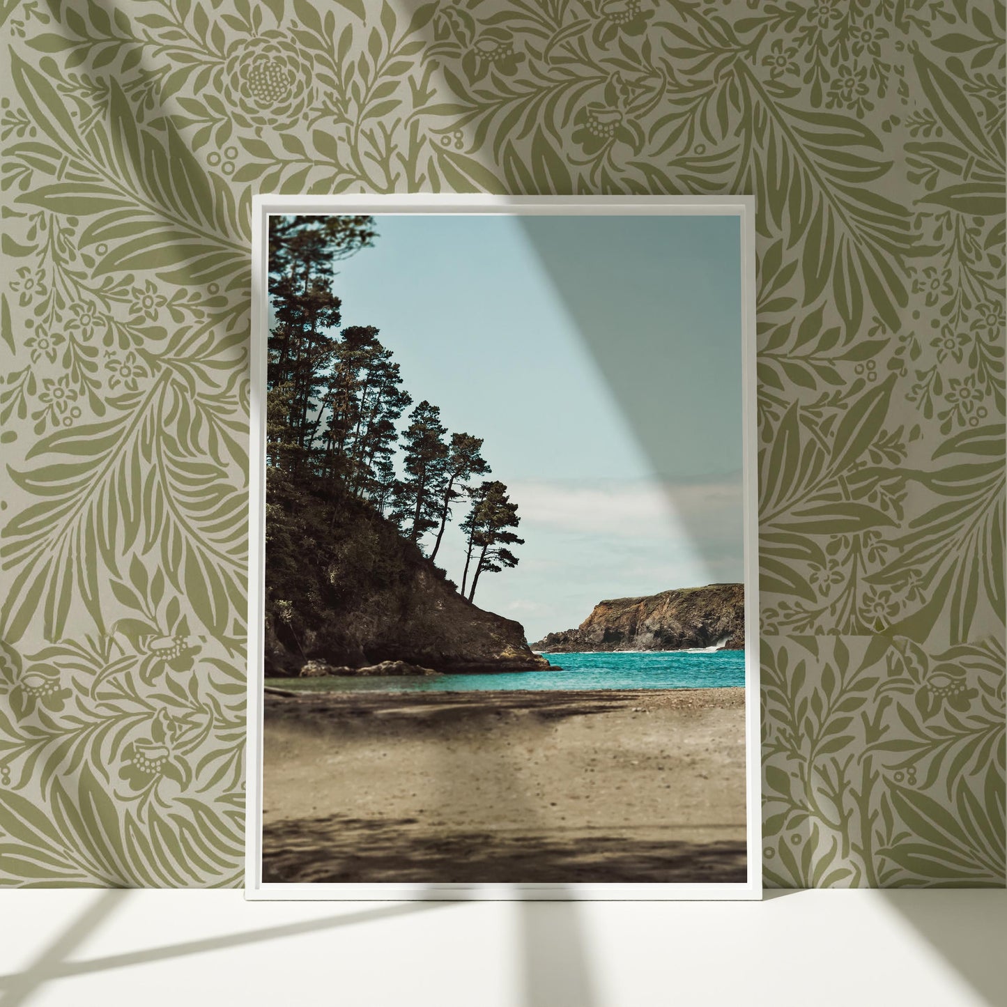 a picture frame hanging on a wall next to a beach