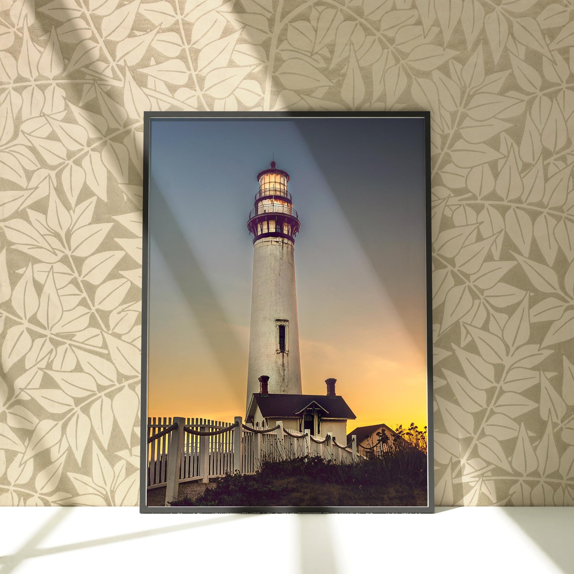 a picture of a lighthouse on a wall