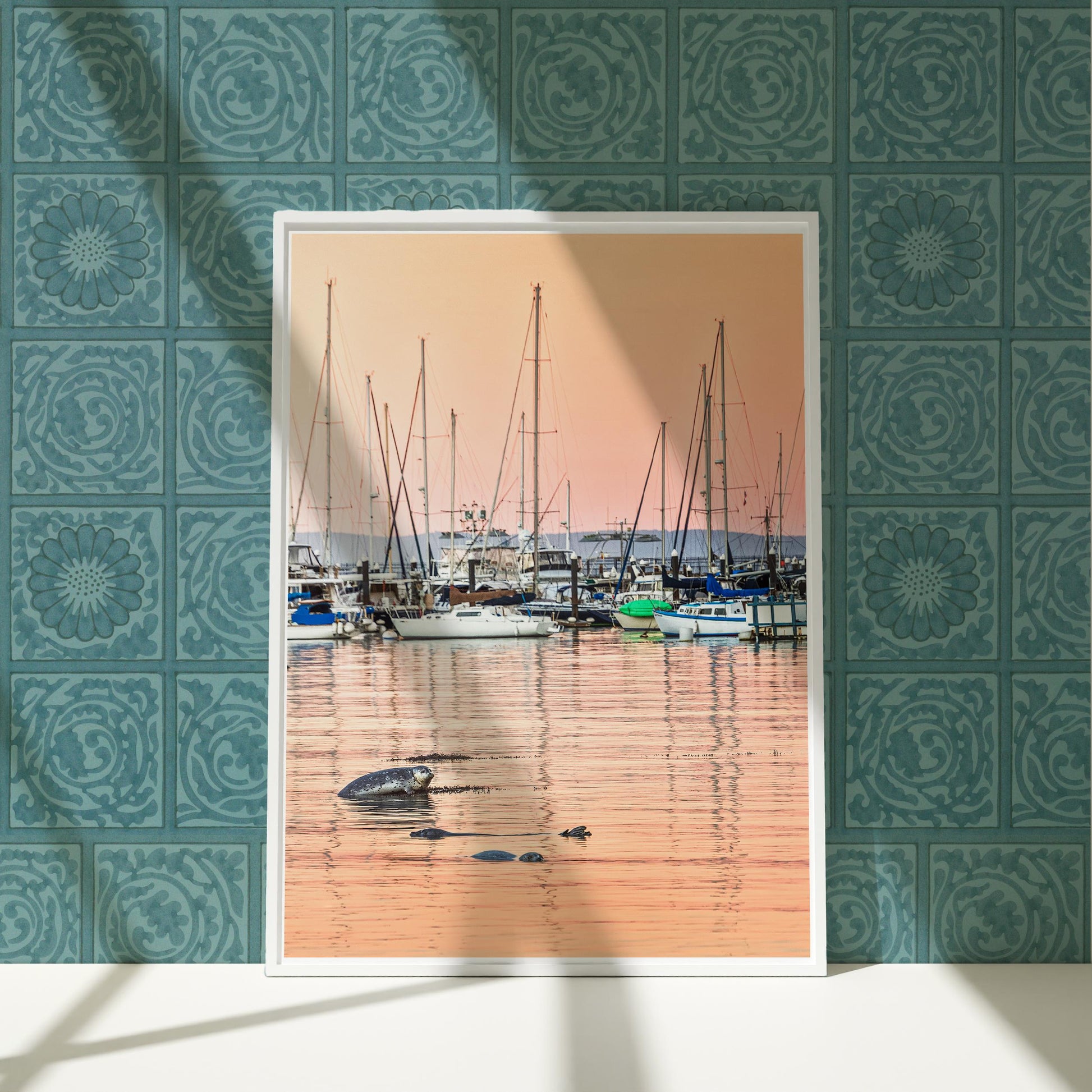 a picture of boats in the water with a blue wall