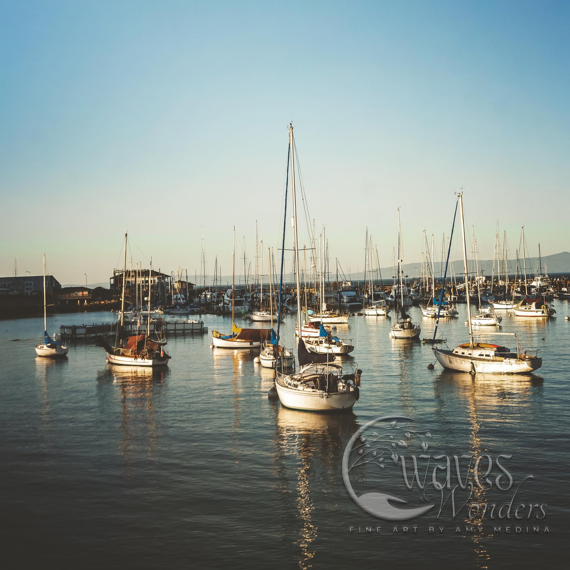 a group of boats floating on top of a body of water