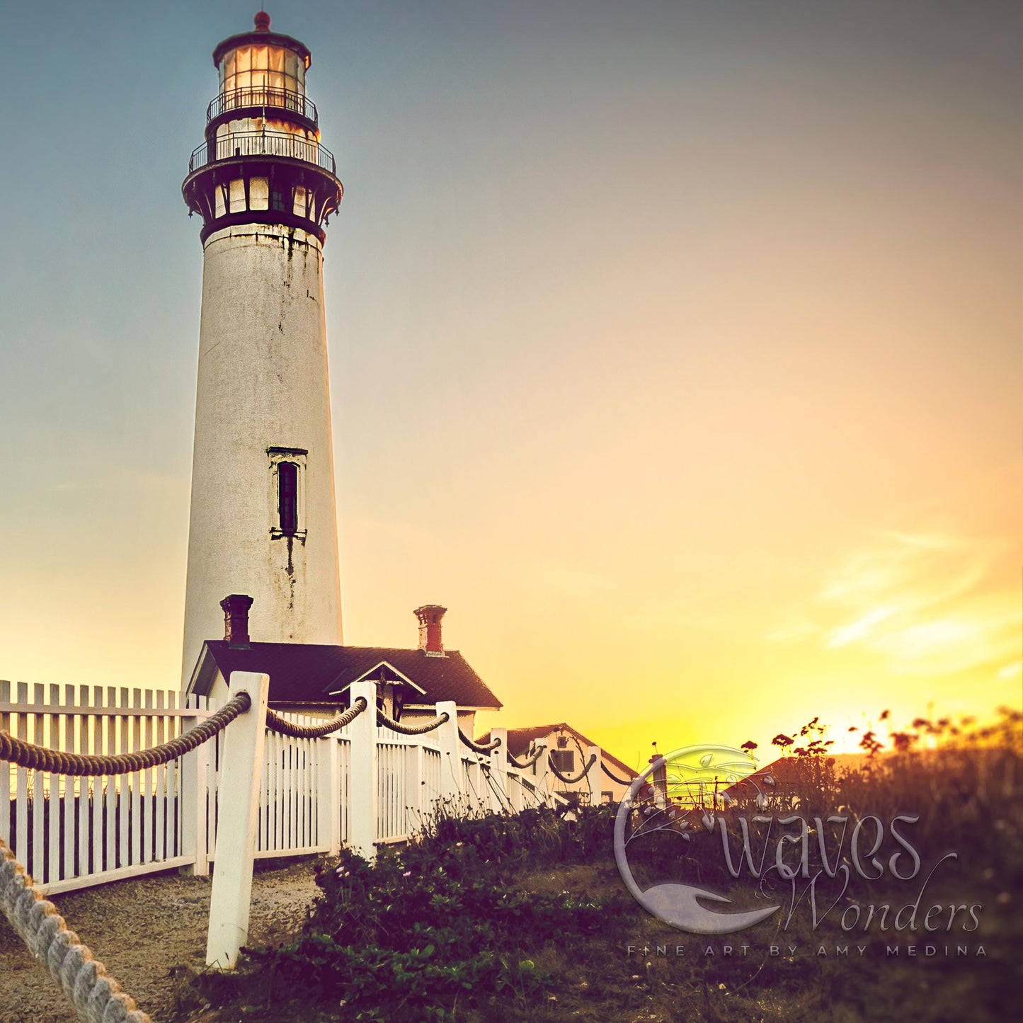 a lighthouse with a white picket fence around it