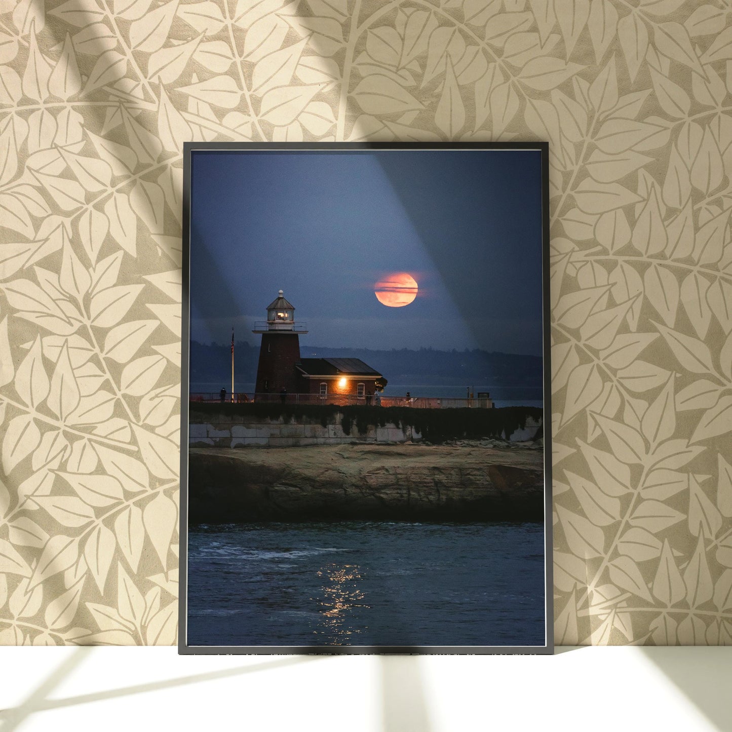 a picture of a lighthouse with a sunset in the background