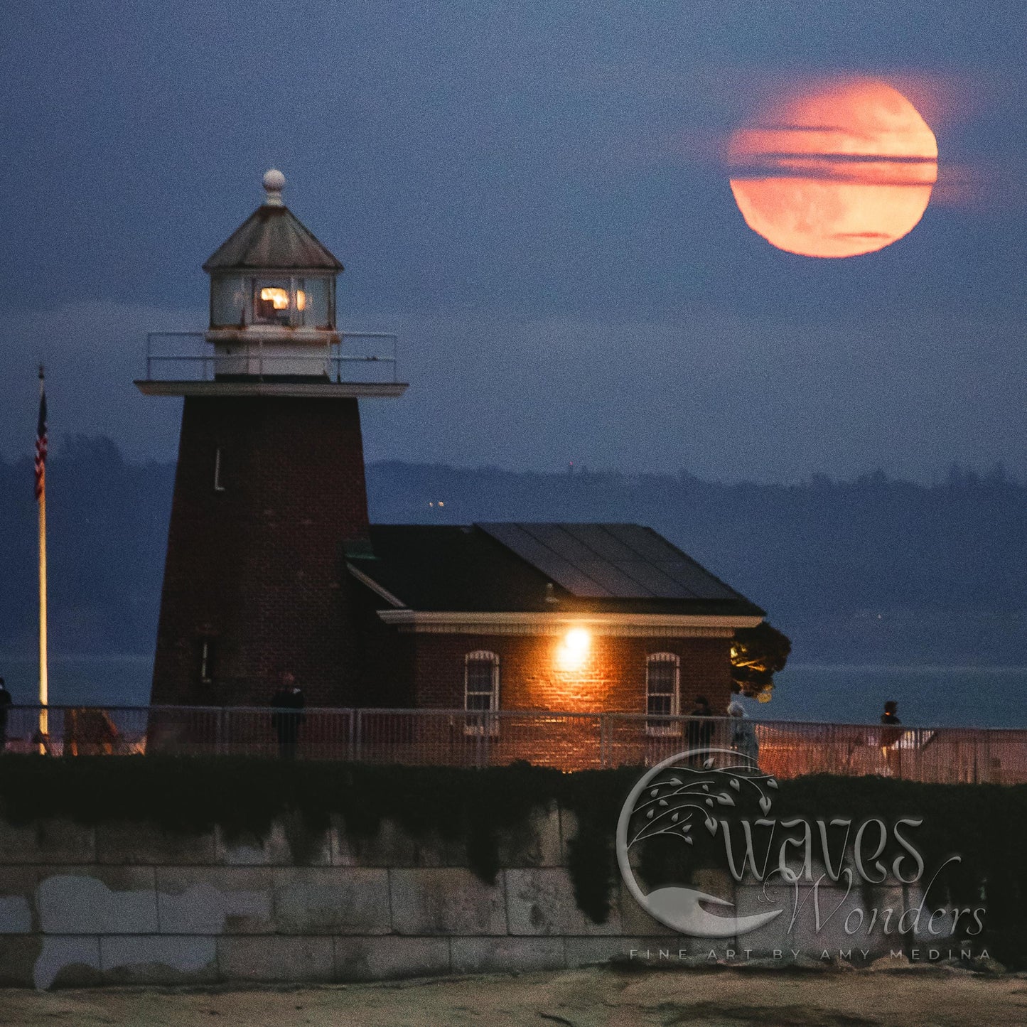 a lighthouse with a full moon in the background